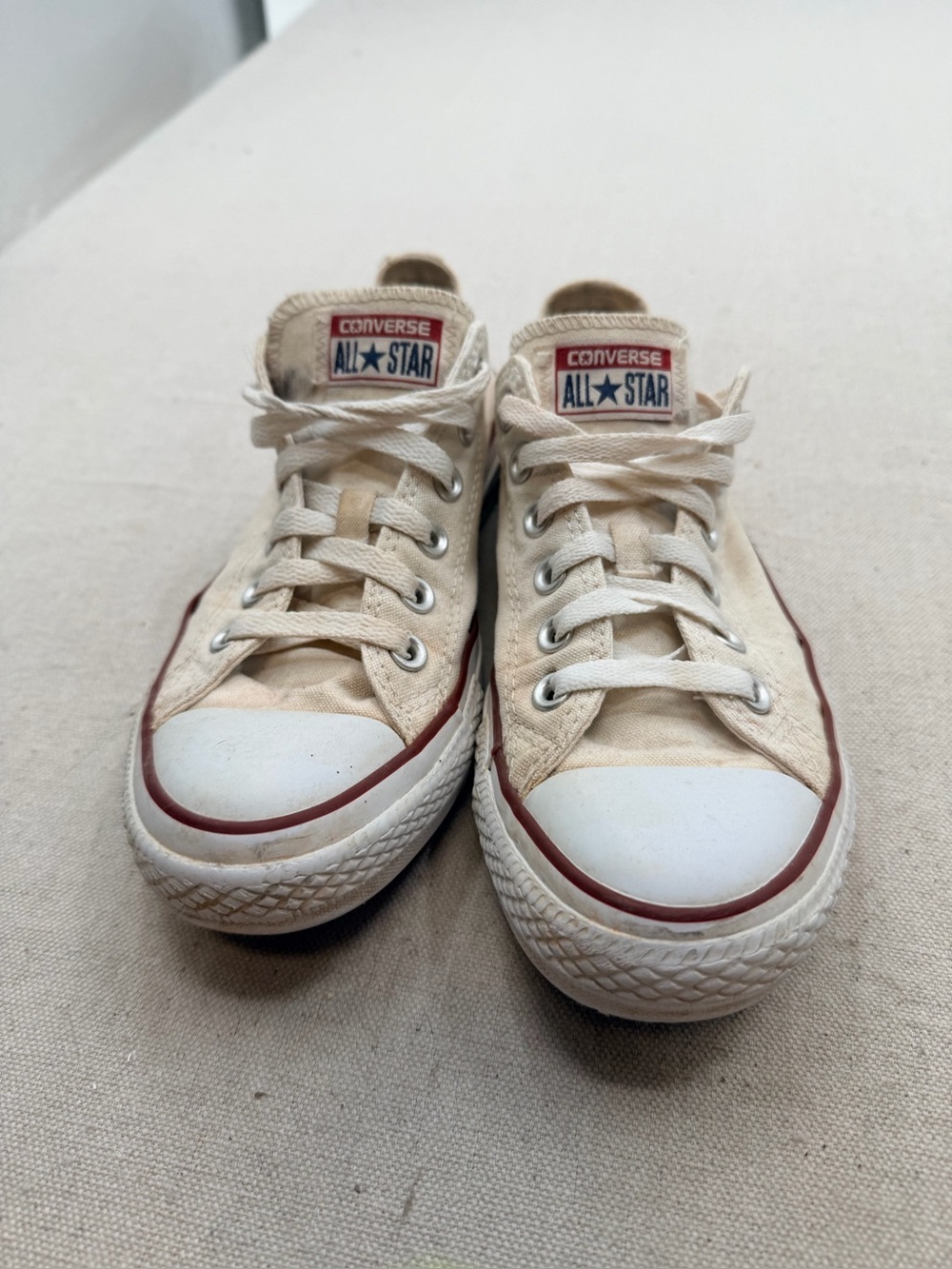Converse Low Top Sneakers in Cream with Red Trim